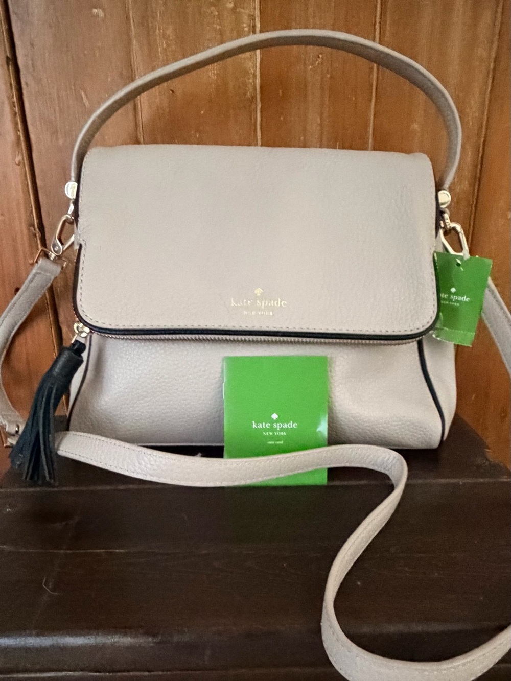 kate spade Pebbled Leather Crossbody Bag in Light Gray with Black Tassel